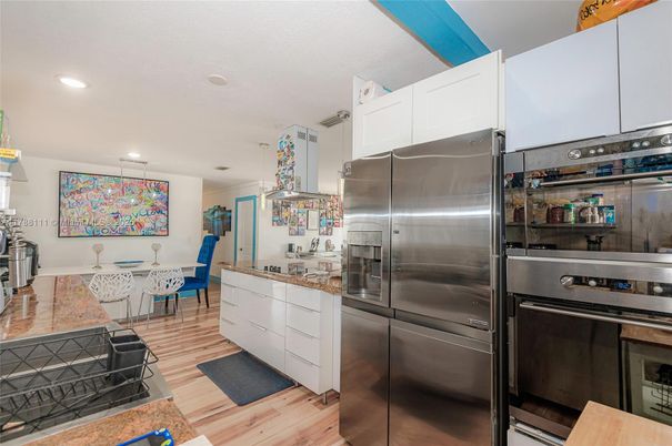 Dining room, Interior, Kitchen, Recessed Lighting, Stainless Steel Appliances, Wood Texture Flooring