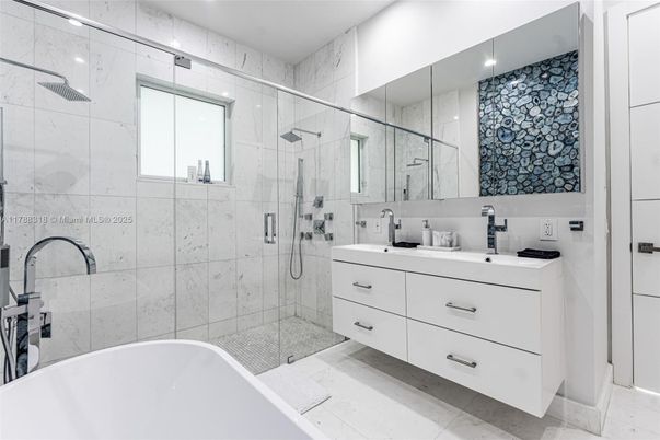 Bathroom, Dual Sink Vanities, Free Standing Baths, Glass Shower, Interior, Marble Walls, Recessed Lighting