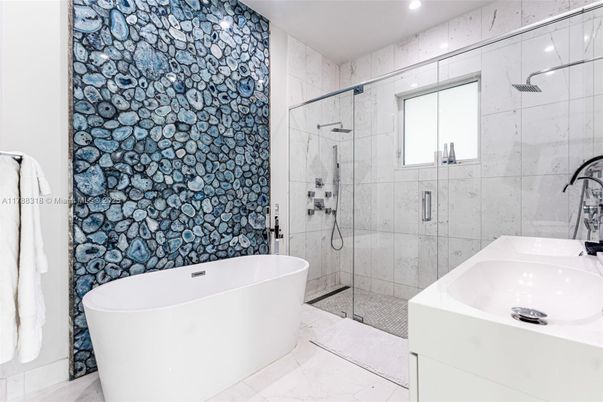 Bathroom, Free Standing Baths, Glass Shower, Interior, Marble Walls, Recessed Lighting