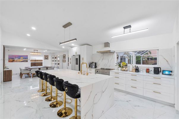 Dining room, Interior, Kitchen, Marble, Marble Walls, Pendant Lights, Recessed Lighting, Stainless Steel Appliances