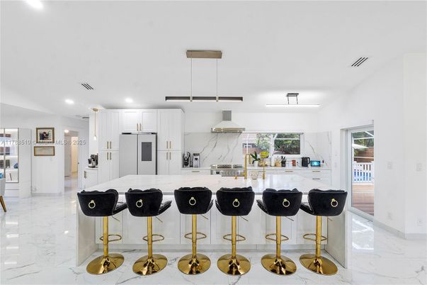 Interior, Kitchen, Marble, Marble Walls, Pendant Lights, Recessed Lighting, Stainless Steel Appliances