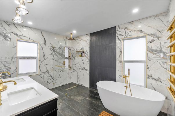 Bathroom, Dual Sink Vanities, Free Standing Baths, Glass Shower, Interior, Marble Walls, Recessed Lighting