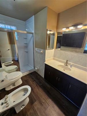 Bathroom, Dual Sink Vanities, Glass Shower, Interior, Wood Texture Flooring