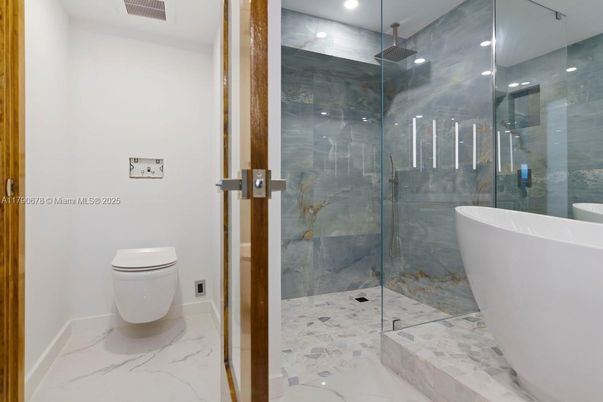 Bathroom, Free Standing Baths, Glass Shower, Interior, Marble, Marble Walls, Recessed Lighting