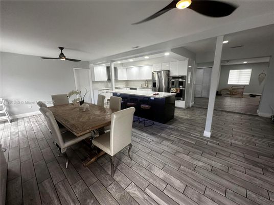 Dining room, Interior, Kitchen, Recessed Lighting, Stainless Steel Appliances, Wood Texture Flooring