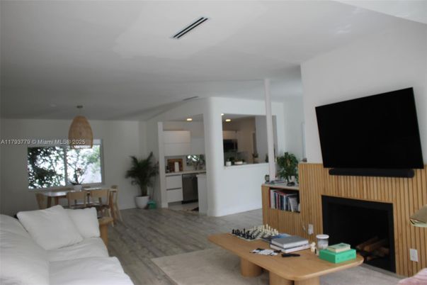 Dining room, Fireplace, Interior, Living room, Recessed Lighting, Wood Texture Flooring