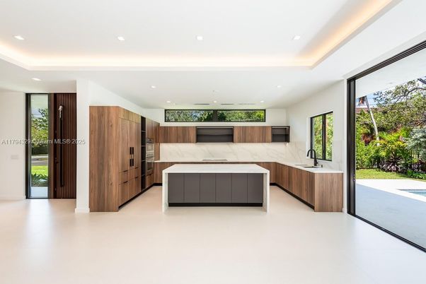 Interior, Kitchen, Marble Walls, Recessed Lighting, Stainless Steel Appliances