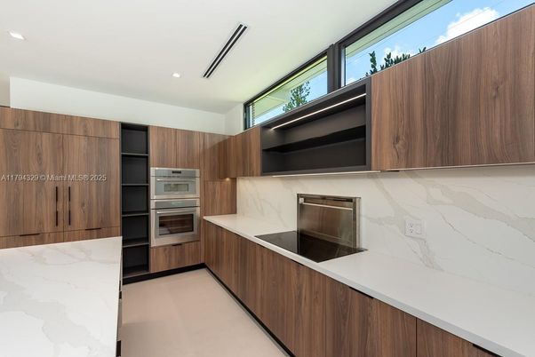 Interior, Kitchen, Marble Walls, Recessed Lighting, Stainless Steel Appliances