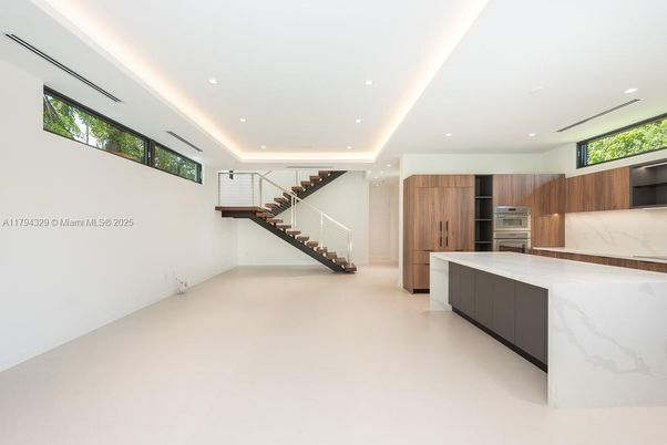 Interior, Kitchen, Marble Walls, Recessed Lighting, Stainless Steel Appliances