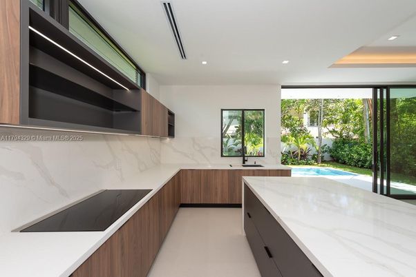 Interior, Kitchen, Marble Walls, Recessed Lighting, Stainless Steel Appliances