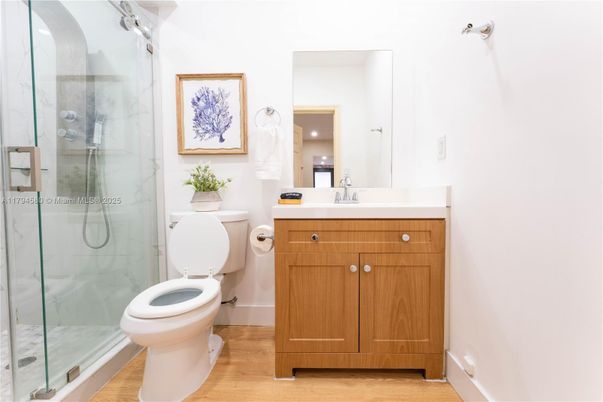 Bathroom, Glass Shower, Interior, Marble Walls, Wood Texture Flooring