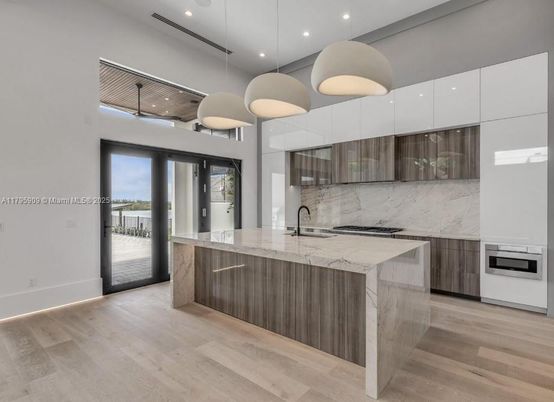 Interior, Kitchen, Marble Walls, Pendant Lights, Recessed Lighting, Stainless Steel Appliances, Wood Texture Flooring