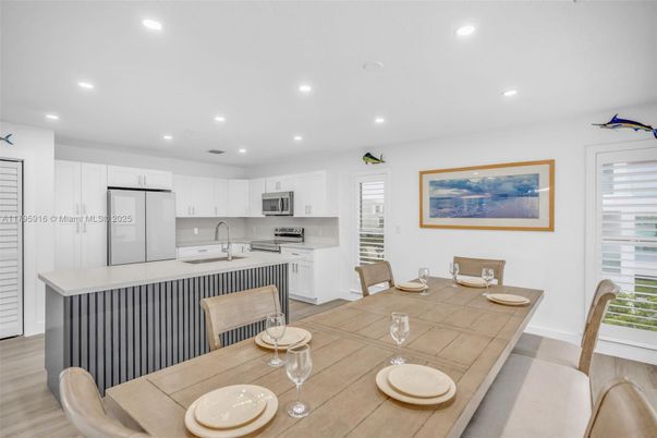 Dining room, Interior, Kitchen, Recessed Lighting, Stainless Steel Appliances, Wood Texture Flooring