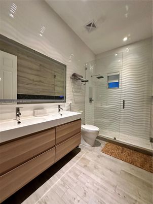 Bathroom, Dual Sink Vanities, Glass Shower, Interior, Recessed Lighting, Wood Texture Flooring