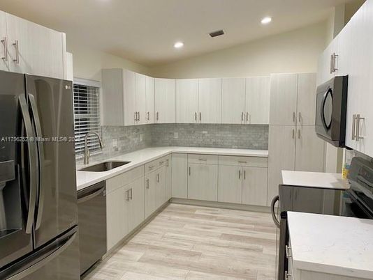 Interior, Kitchen, Recessed Lighting, Stainless Steel Appliances, Wood Texture Flooring