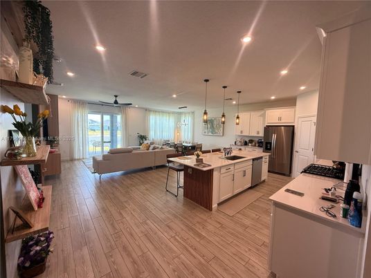 Dining room, Interior, Kitchen, Living room, Pendant Lights, Recessed Lighting, Stainless Steel Appliances, Wood Texture Flooring