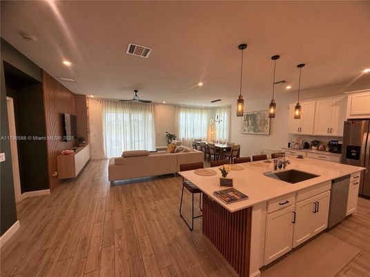 Dining room, Interior, Kitchen, Living room, Pendant Lights, Recessed Lighting, Stainless Steel Appliances, Wood Texture Flooring