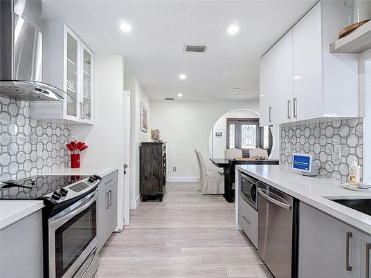 Dining room, Interior, Kitchen, Recessed Lighting, Stainless Steel Appliances, Wood Texture Flooring