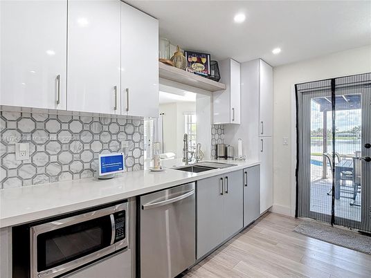 Interior, Kitchen, Recessed Lighting, Stainless Steel Appliances, Wood Texture Flooring