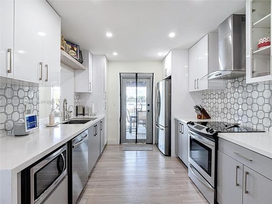 Interior, Kitchen, Recessed Lighting, Stainless Steel Appliances, Wood Texture Flooring