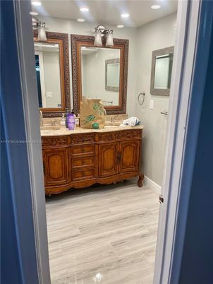 Bathroom, Dual Sink Vanities, Interior, Recessed Lighting, Wood Texture Flooring