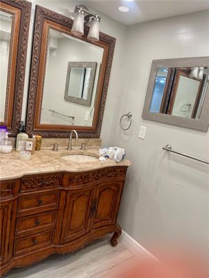 Bathroom, Dual Sink Vanities, Interior, Recessed Lighting, Wood Texture Flooring