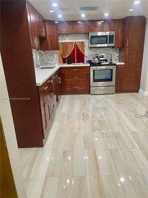 Interior, Kitchen, Recessed Lighting, Stainless Steel Appliances, Wood Texture Flooring