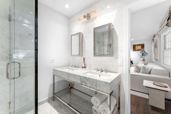 Bathroom, Dual Sink Vanities, Glass Shower, Interior, Marble, Marble Walls, Recessed Lighting, Wood Texture Flooring