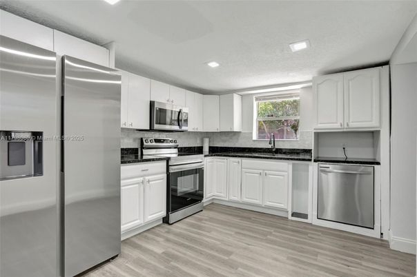 Interior, Kitchen, Recessed Lighting, Stainless Steel Appliances, Wood Texture Flooring