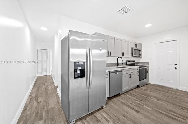 Interior, Kitchen, Recessed Lighting, Stainless Steel Appliances, Wood Texture Flooring