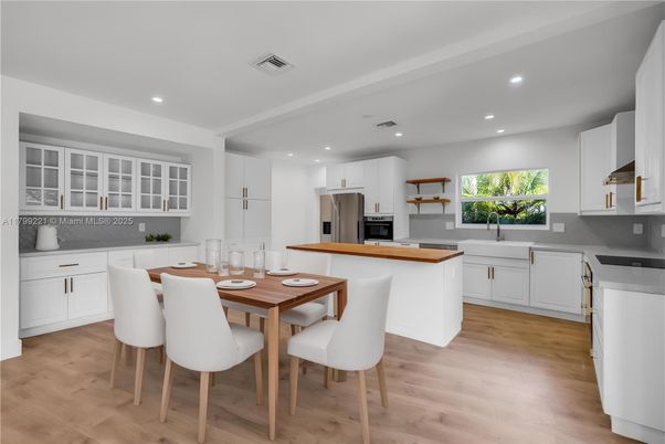 Dining room, Interior, Kitchen, Recessed Lighting, Stainless Steel Appliances, Wood Texture Flooring