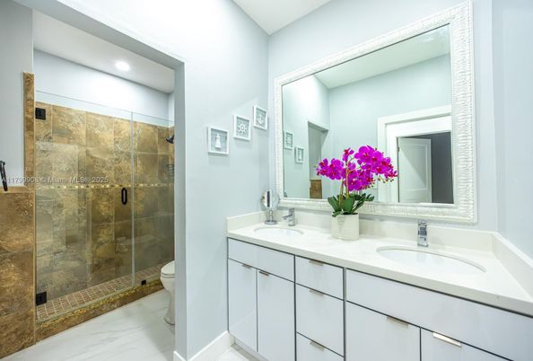 Bathroom, Dual Sink Vanities, Glass Shower, Interior, Marble, Recessed Lighting