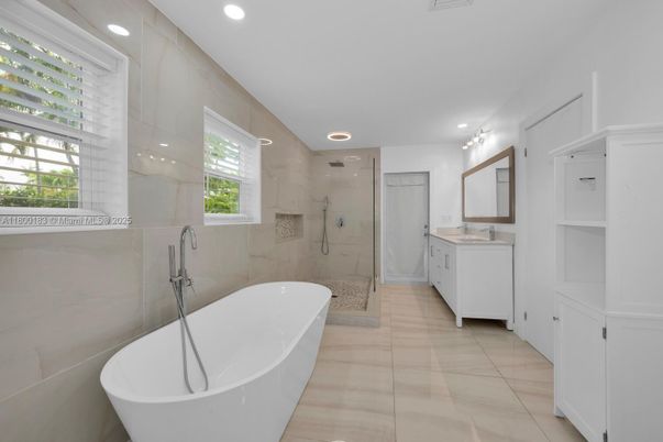 Bathroom, Dual Sink Vanities, Free Standing Baths, Glass Shower, Interior, Marble Walls, Recessed Lighting