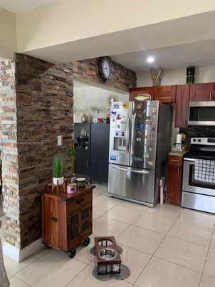 Interior, Kitchen, Recessed Lighting, Stainless Steel Appliances, Stone Walls
