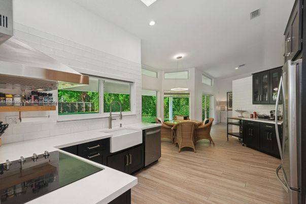 Dining room, Interior, Kitchen, Pendant Lights, Recessed Lighting, Stainless Steel Appliances, Wood Texture Flooring