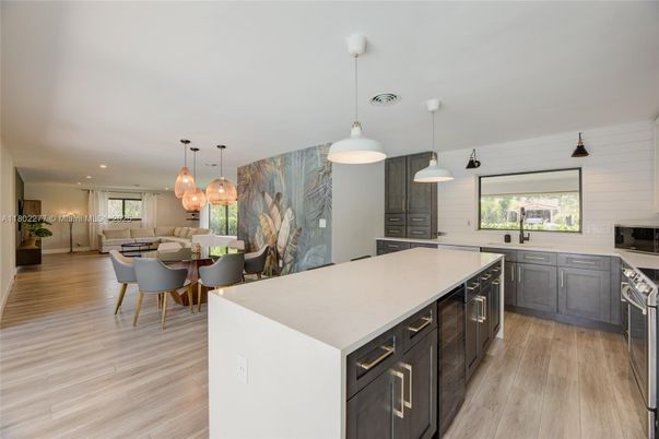 Dining room, Interior, Kitchen, Pendant Lights, Recessed Lighting, Stainless Steel Appliances, Wood Texture Flooring