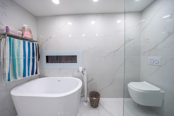Bathroom, Fireplace, Free Standing Baths, Interior, Marble, Marble Walls, Recessed Lighting
