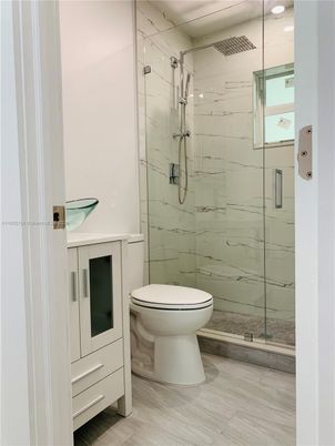 Bathroom, Glass Shower, Interior, Marble Walls, Recessed Lighting, Wood Texture Flooring