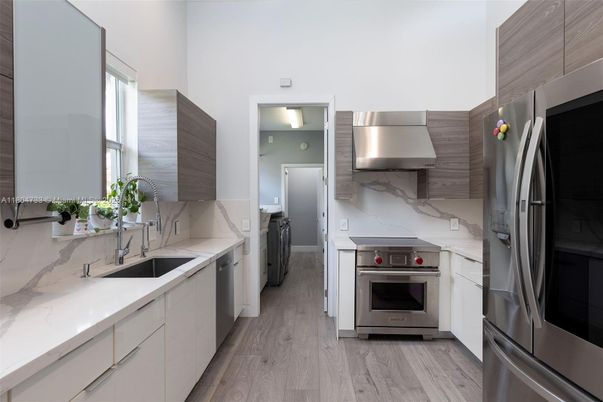 Interior, Kitchen, Marble Walls, Stainless Steel Appliances, Wood Texture Flooring