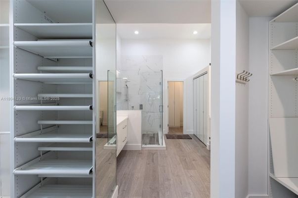 Bathroom, Interior, Marble Walls, Recessed Lighting, Walk-in Closets, Wood Texture Flooring
