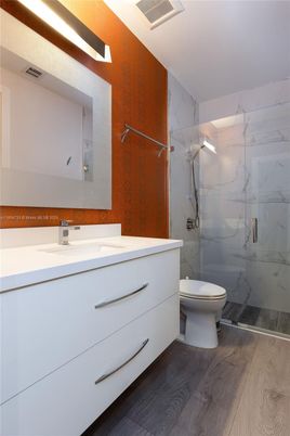 Bathroom, Glass Shower, Interior, Marble Walls, Wood Texture Flooring