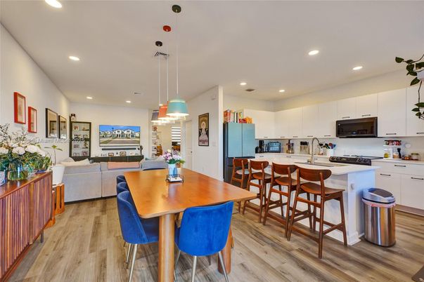 Dining room, Interior, Kitchen, Living room, Pendant Lights, Recessed Lighting, Stainless Steel Appliances, Wood Texture Flooring