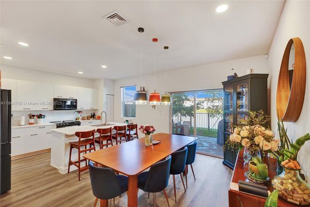 Dining room, Interior, Kitchen, Pendant Lights, Recessed Lighting, Stainless Steel Appliances, Wood Texture Flooring
