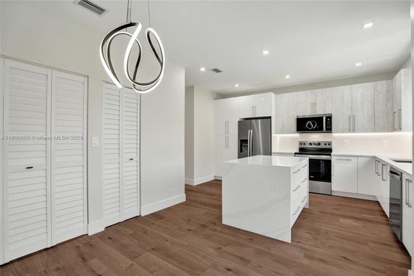 Interior, Kitchen, Pendant Lights, Recessed Lighting, Stainless Steel Appliances, Wood Texture Flooring