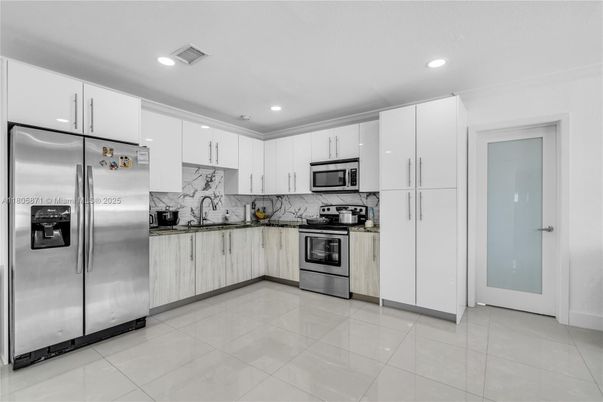 Interior, Kitchen, Marble Walls, Recessed Lighting, Stainless Steel Appliances