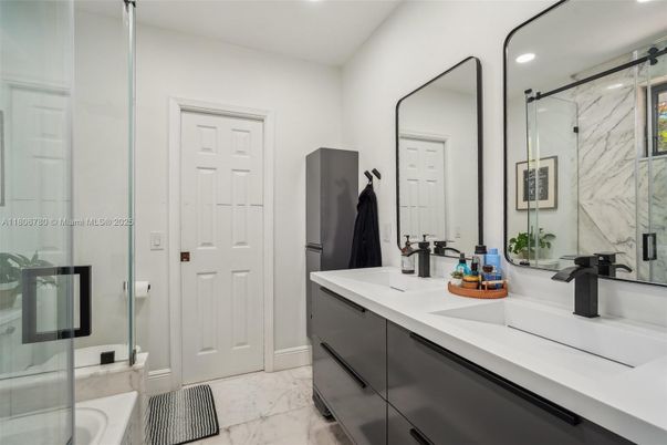 Bathroom, Dual Sink Vanities, Glass Shower, Interior, Marble, Marble Walls, Recessed Lighting