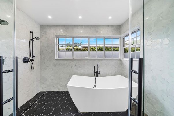 Bathroom, Free Standing Baths, Glass Shower, Interior, Marble Walls, Recessed Lighting
