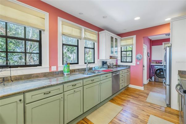 Interior, Kitchen, Recessed Lighting, Washer, Wood Texture Flooring