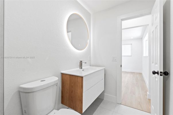 Bathroom, Dual Sink Vanities, Interior, Recessed Lighting, Wood Texture Flooring