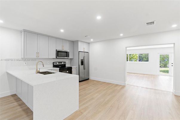Interior, Kitchen, Recessed Lighting, Stainless Steel Appliances, Wood Texture Flooring